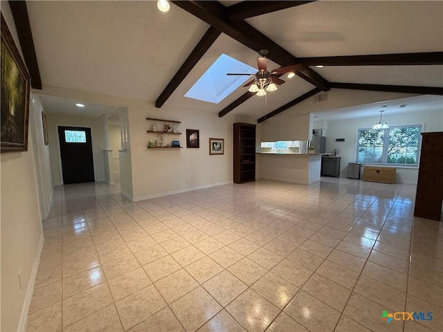 1001 Brookhollow Dr, Port Lavaca, TX 77979 - unfurnished living room featuring light tile patterned flooring, ceiling fan, a skylight, recessed lighting, and a chandelier