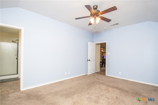 carpeted empty room featuring ceiling fan, a textured ceiling, and lofted ceiling