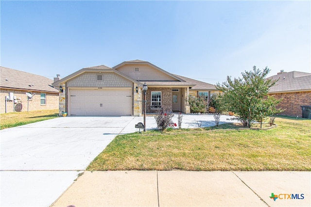 view of front of house with a garage and a front yard