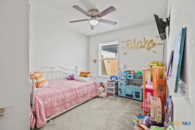 carpeted bedroom featuring ceiling fan