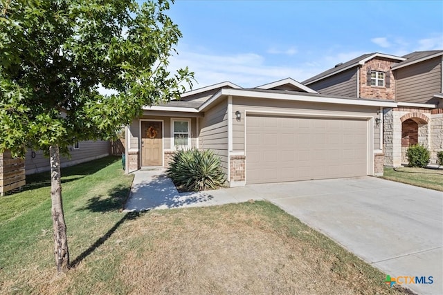 ranch-style home featuring a garage and a front yard