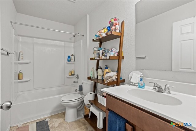 full bathroom featuring  shower combination, vanity, and toilet