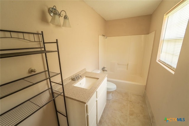 bathroom featuring shower / washtub combination, vanity, tile patterned floors, and toilet