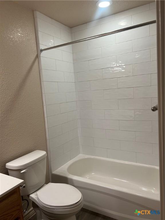 full bathroom featuring vanity, toilet, and shower / bath combination