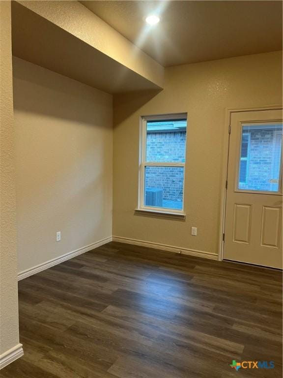 foyer entrance with dark hardwood / wood-style flooring