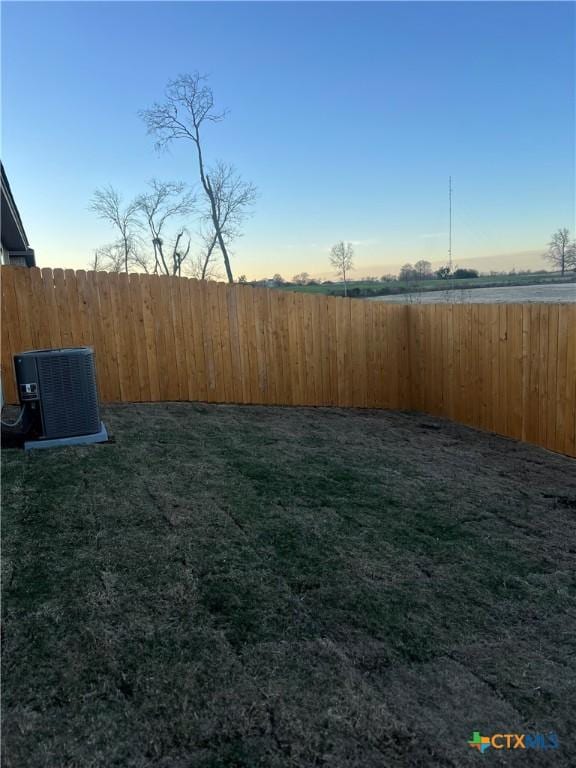 view of yard with central air condition unit