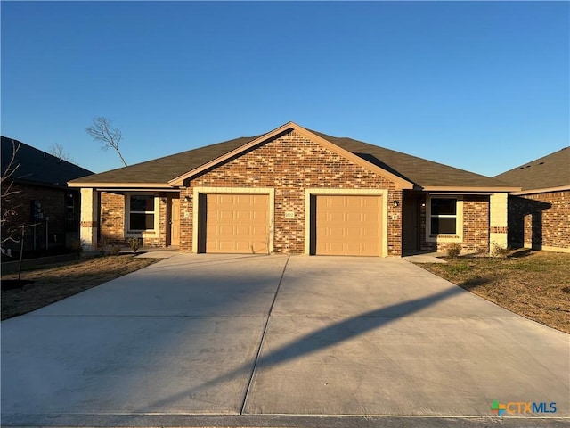 ranch-style home featuring a garage