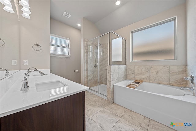 bathroom with vanity and independent shower and bath