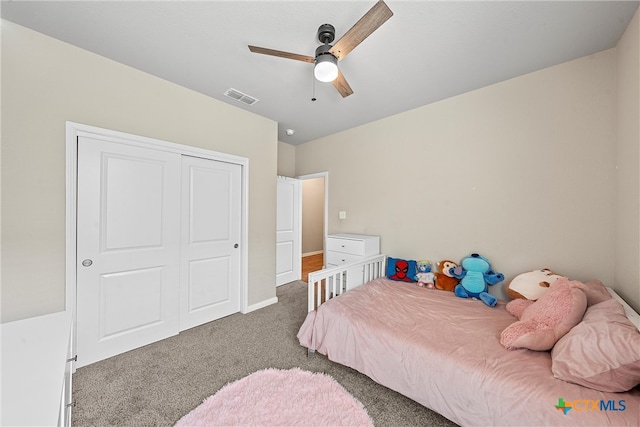 bedroom featuring ceiling fan, a closet, and carpet