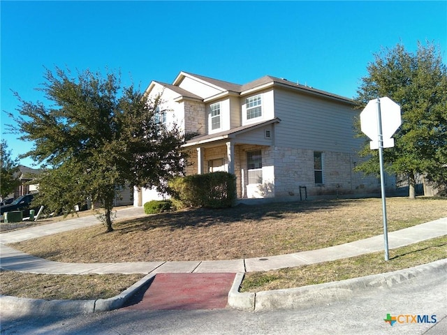 view of front of home featuring a front lawn