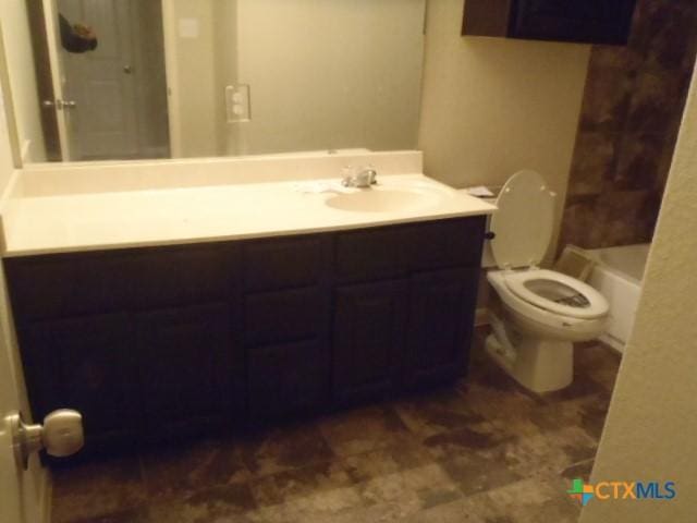 full bathroom with vanity, shower / tub combination, and toilet