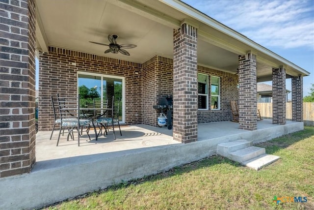 view of patio with ceiling fan and grilling area