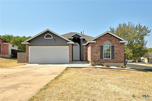 single story home featuring a garage