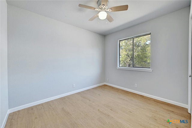 empty room featuring ceiling fan and light wood-type flooring