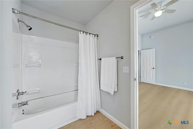 bathroom featuring ceiling fan, shower / bath combination with curtain, and hardwood / wood-style flooring