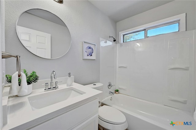 full bathroom with vanity, bathtub / shower combination, and toilet