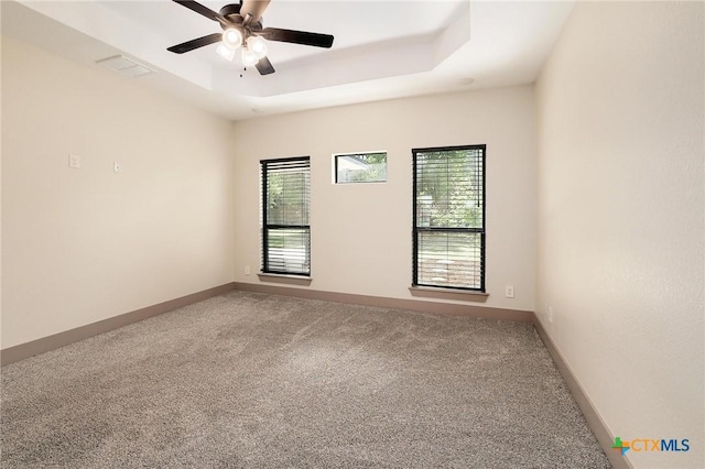 2892 Beulah Blvd, Belton, TX 76513 - empty room featuring carpet floors, a tray ceiling, a ceiling fan, and baseboards