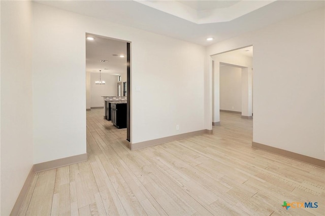 2892 Beulah Blvd, Belton, TX 76513 - spare room featuring light wood finished floors, recessed lighting, baseboards, and a chandelier