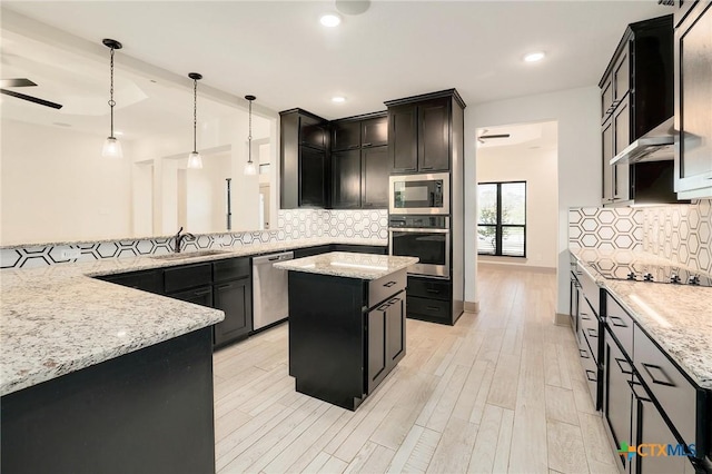 2892 Beulah Blvd, Belton, TX 76513 - kitchen featuring stainless steel appliances, a ceiling fan, tasteful backsplash, light stone countertops, and wall chimney exhaust hood