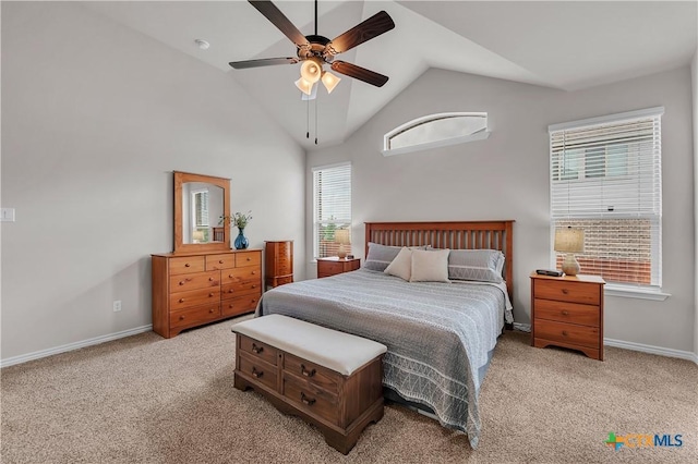 bedroom with vaulted ceiling, light colored carpet, and ceiling fan