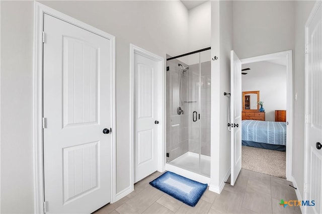 bathroom with tile patterned flooring and walk in shower