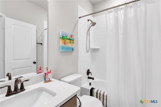 full bathroom featuring vanity, shower / tub combo, and toilet