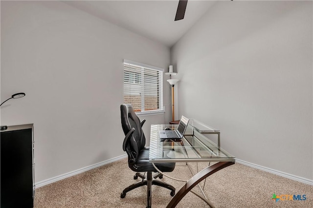 carpeted office with vaulted ceiling