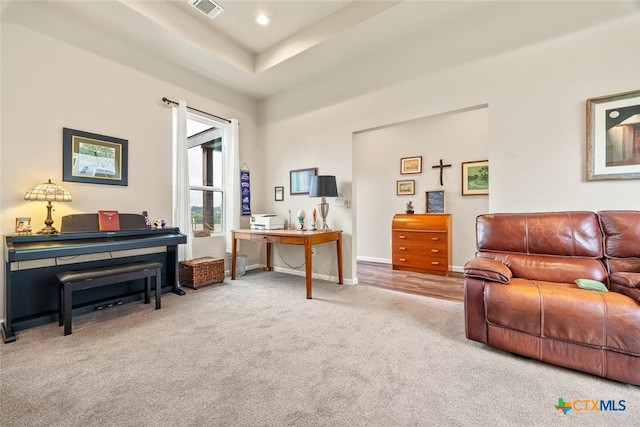 sitting room with carpet floors