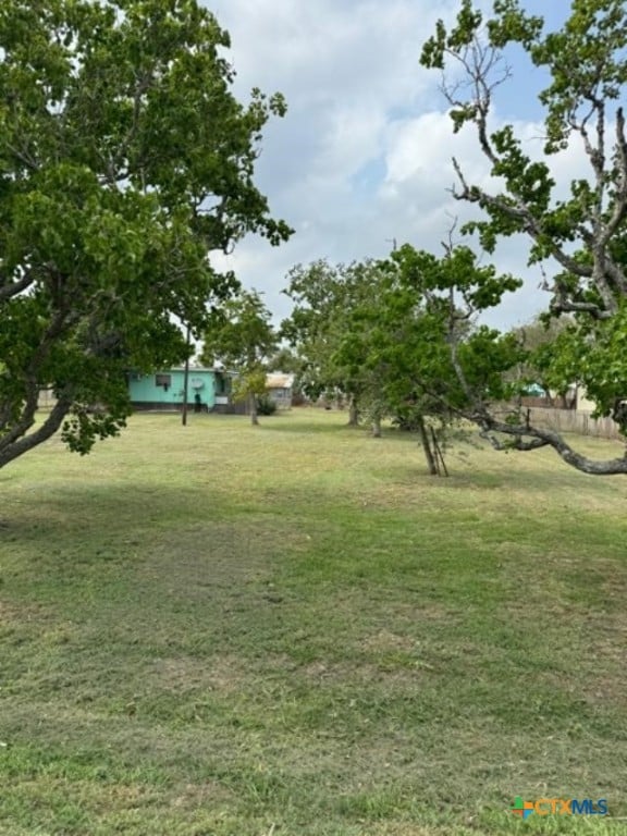 view of home's community with a yard