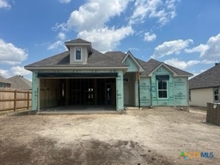 unfinished property with a garage