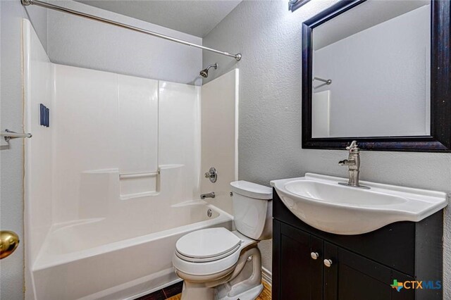 bathroom with hardwood / wood-style floors, vanity, and a healthy amount of sunlight