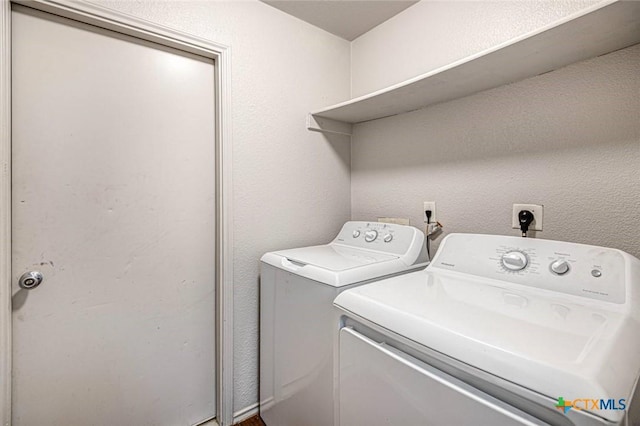 laundry room with separate washer and dryer