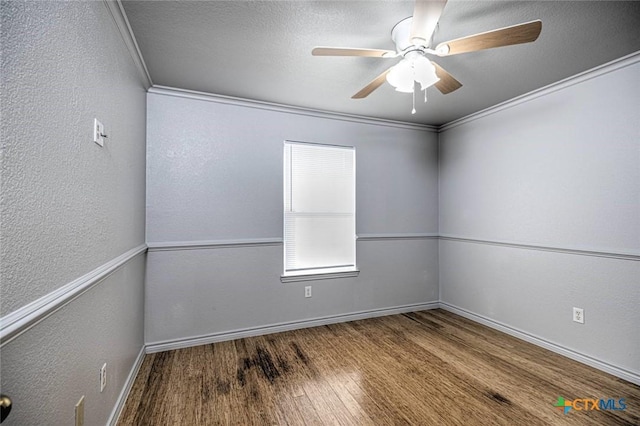 empty room featuring crown molding, ceiling fan, a textured ceiling, and hardwood / wood-style flooring