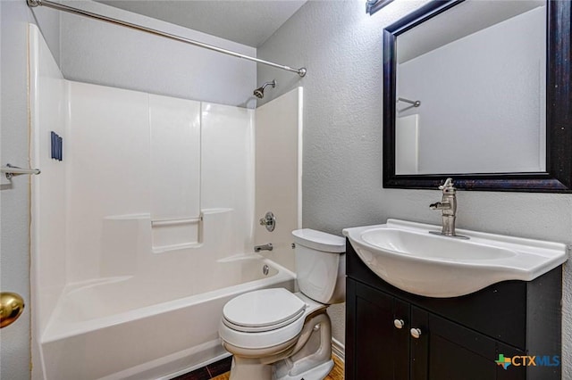 full bathroom featuring toilet, vanity, and washtub / shower combination