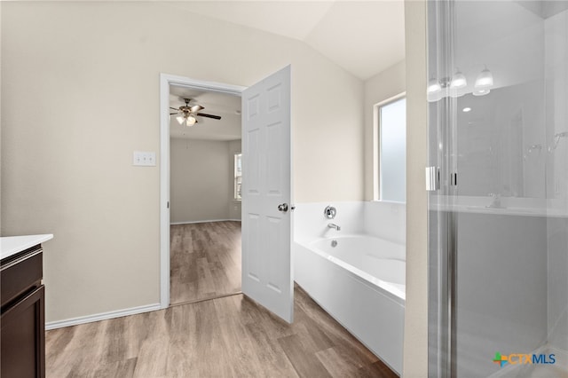 2503 Pintail Loop, Copperas Cove, TX 76522 - bathroom with vanity, wood finished floors, a bath, a stall shower, and a ceiling fan