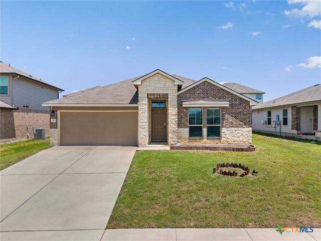2503 Pintail Loop, Copperas Cove, TX 76522 - view of front of property with stone siding, an attached garage, a front lawn, and concrete driveway