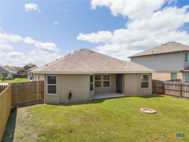 2503 Pintail Loop, Copperas Cove, TX 76522 - rear view of property with a fenced backyard, a patio, a fire pit, and roof with shingles
