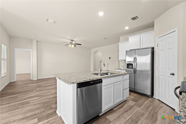 2503 Pintail Loop, Copperas Cove, TX 76522 - kitchen featuring stainless steel appliances, ceiling fan, a kitchen island with sink, light wood finished floors, and white cabinetry