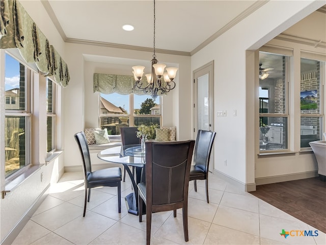 535 Mission Hill Run, New Braunfels, TX 78132 - dining space featuring a chandelier, ornamental molding, light tile patterned floors, and baseboards