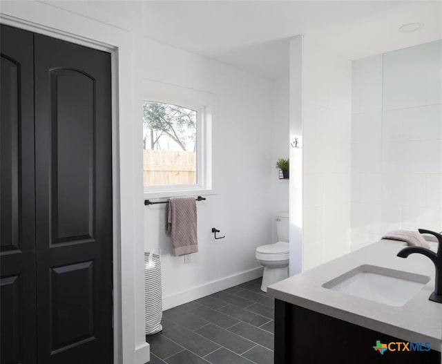 119 W Crockett St, Luling, TX 78648 - bathroom with tile patterned flooring and vanity