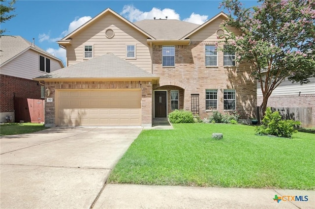 view of front of house featuring a garage, brick siding, fence, concrete driveway, and a front lawn