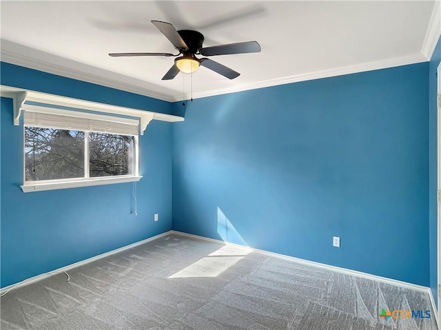 carpeted spare room with crown molding and ceiling fan