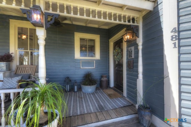 entrance to property featuring a porch