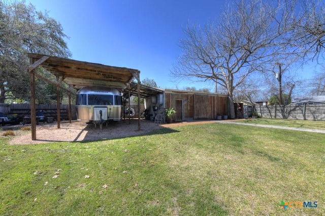 view of yard with a detached carport