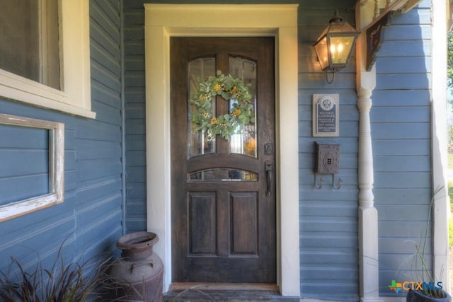 property entrance featuring covered porch