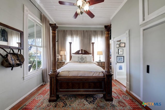 bedroom featuring crown molding, wood finished floors, baseboards, and ceiling fan