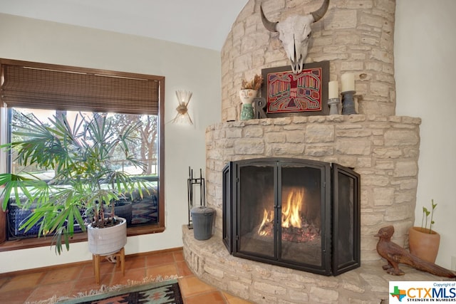 details with a fireplace and tile patterned floors