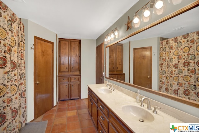 bathroom with vanity and tile patterned flooring