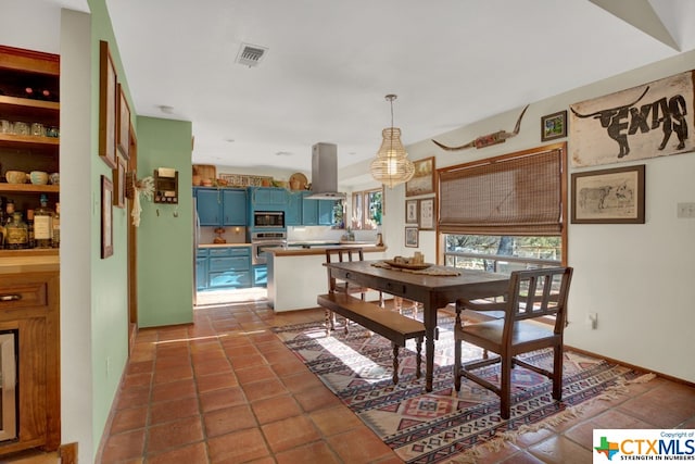 dining room featuring dark tile patterned floors