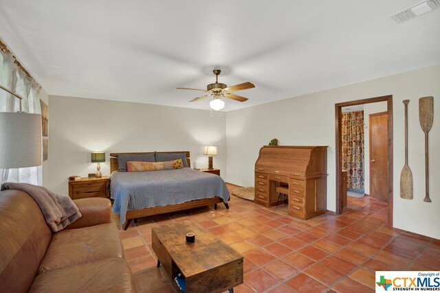 tiled bedroom with ceiling fan